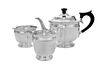 A George VI Silver Three-Piece Tea Service, William Barnard & Son, London, 1938, comprising a teapot, creamer and waste bowl.