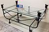 WROUGHT GLASS TOP COFFEE TABLE WITH DOG HEAD FINIALS. 23 1/2"H X 4"W X 26"D