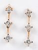 Pair of 14K gold and diamond earrings
