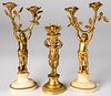 Three gilt bronze figural candlesticks
