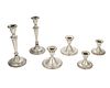 A group of weighted sterling silver candlesticks