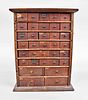 Two 34 drawer oak watchmakers parts cabinets