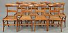 Set of eight figured maple chairs with caned seats.