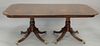 Custom mahogany double pedestal dining table with banded inlaid top and 2 leaves. top: 48" x 78"; opens to 126"