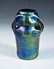 A Continental Art Nouveau Eosin glazed vase, possibly Zsolnay, the iridescent body with three pinche