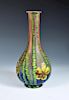 A good Kralik 'Marquetry' glass vase, the bottle form with slender neck, depicting yellow flowers an