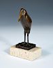 After Francois Pompon, (French, 1855-1933), a patinated bronze model of a stylised stork, mounted on