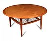 A Danish coffee table, possibly designed by Johannes Andersen, the circular top supported tapering c