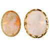 Two cameo brooches. One shell carving depicting Athena and Minerva and a winged torch-bearer, the ot