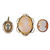 Two cameo brooches and a locket. The locket of oval outline, with a seed pearl and green gem-set cro