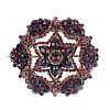A late 19th century garnet and paste brooch. The vari-shape openwork garnet and paste brooch. One re