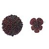 Two late 19th century garnet and paste brooches. To include a circular-shape red paste and garnet fl