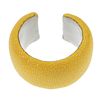A stingray cuff. The yellow cuff with white leather lining signed Maximos. Inner diameter 5.5cms.  <