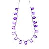 An amethyst fringe necklace. Designed as a series of suspended oval amethyst cabochons, to the bar-l