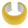 A yellow stingray cuff. The bright yellow stingray cuff with white leather lining signed Maximos. In
