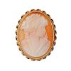 A bangle and a 9ct gold cameo brooch. The bangle with acanthus engraving, colourless and blue pastes