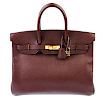 HERMES - a Togo 35cm Birkin Bag. Featuring a brown pebbled Togo leather exterior, dual rolled handle