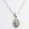 Lady's 18 Karat White Gold Pendant Necklace Accented with Small Round Cut Diamonds.