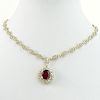 AIG Certified 6.96 Carat Oval Cut Ruby, 9.95 Carat Round Cut Diamond and 14 Karat Yellow Gold Necklace.