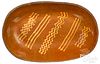 Pennsylvania redware deep oval loaf dish, mid 19th