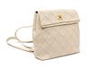 A Chanel Cream Caviar Leather Quilted Backpack, 12"x 10" x 3".