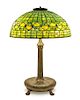 A Tiffany Studios Favrile Glass and Bronze Acorn Lamp, Height overall 23 x diameter of shade 16 inches.