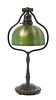 A Tiffany Studios Favrile Glass and Bronze Lamp, Height overall 18 1/8 x diameter of shade 7 1/8 inches.