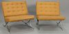 Pair of Barcelona chairs with leather seats tagged Industria Argentina (one chair missing button). wd. 31 in.