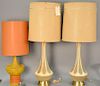 Three lamps including a pair of Mid-Century lamps with round brass base (total ht. 39 in.without shade) and an orange and yellow lamp.