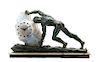 A Cast Metal and Molded Glass Sisyphus Figural Clock, after Max Le Verrier, Height 14 3/4 x width of base 25 3/8 x depth 5 1/2 i