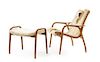 * A Yngve Ekstrom Beech Lamino Lounge Chair and Ottoman, Height of chair 30 3/4 inches.