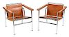 A Pair of Le Corbusier Chromed Steel Basculant Chairs, Height 25 1/2 inches.