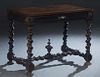 French Louis XIII Style Carved Oak Writing Table, 19th c., the stepped rounded edge top over a long frieze drawer, on rope twist trestle supports join