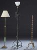 Three French Iron Floor Lamps, early 20th c., one of wrought iron with scrolled decoration, to scrolled twisted tripodal legs, H.- 70 in., Dia.- 17 1/