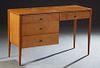 Paul McCobb Planner Group Mid-Century Modern Maple Desk, mid 20th c., with two frieze drawers over two drawers on one side, labeled in the upper left 