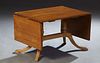 English Carved Mahogany Drop Leaf Coffee Table, 20th c., on a trestle support with four reeded cabriole legs, H.- 17 1/2 in., W.- Closed- 28 1/2 in., 