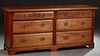 French Provincial Carved Cherry Sideboard, 20th c., the ogee edge rectangular top over two frieze drawers above four deep drawers, flanked by reeded p