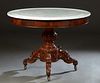 French Carved Walnut Marble Top Center Table, 19th c., the dished figural white circular marble over a wide skirt on a tapered urn support on tripodal