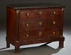 French Empire Style Ormolu Mounted Carved Walnut Marble Top Commode, mid 19th c., the figured black marble over three setback drawers, flanked by ormo