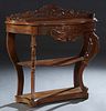 French Louis XV Style Carved Walnut Console Table, late 19th c., the pierce carved floral gallery over a bowed stepped base with a long floral carved 