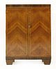 An Art Deco walnut and rosewood bar,<BR>the top hinged and opening to reveal a mirror, over shelves