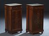 Pair of French Louis Philippe Style Carved Walnut Marble Top Nightstands, late 19th c., the inset white marble over a frieze drawer and a four faux dr