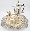Four Piece Silver Set, to include teapot, sugar, creamer, and round tray, diameter of tray 15 1/4 inches, 102.7 t.oz. Provenance: Collections of Norma