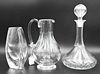 Three Baccarat Crystal Pieces, to include a decanter, vase, and a pitcher, tallest 12 1/2 inches.