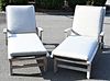 Pair of Teak Lounges, having mesh and custom cushions with adjustable uppers and wheels, length 72 inches, width 32 inches.