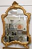 Shaped Gilt Carved Mirror, 49" x 32". Provenance: The Estate of Alina Roisen, Park Avenue, New York.