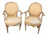 Pair of Early Italian Neoclassical Parcel Armchairs, gilt and white painted, height 38 inches, width 26 inches, (one arm broken near back). Provenance