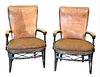 Pair of Occasional Armchairs, having leather backs and rattan wrapped base, (wear to backs), height 43 1/2 inches.