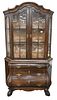 Continental Style Small Breakfront, having cloth interior and two shelves, height 77 inches, width 45 inches.