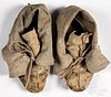 Two pairs of Native American hide moccasins